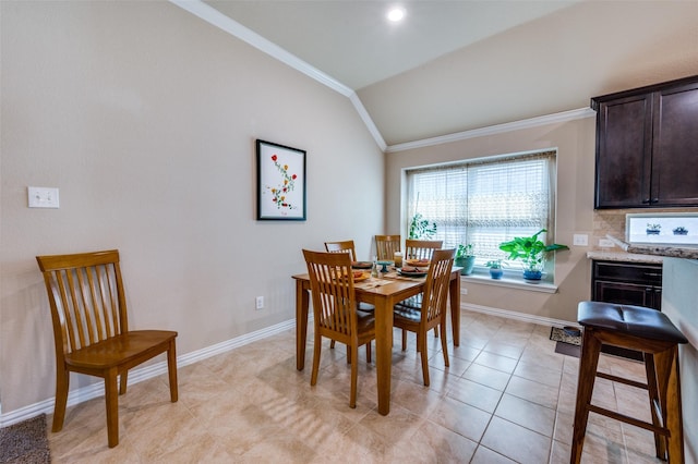 11408 Aquilla Dr, Frisco, TX 75036 - dining area featuring crown molding, lofted ceiling, baseboards, and light tile patterned floors