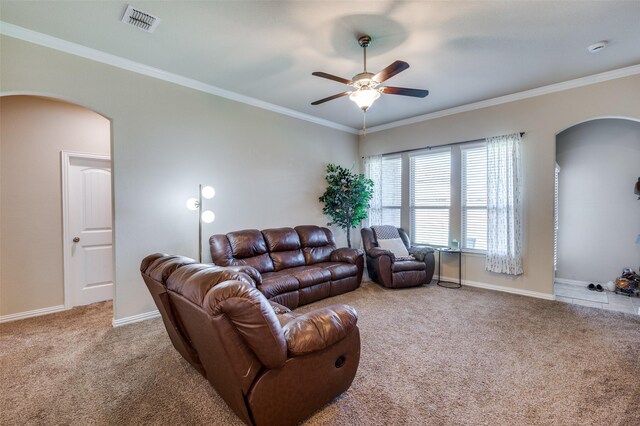 11408 Aquilla Dr, Frisco, TX 75036 - carpeted living room with arched walkways, a ceiling fan, crown molding, and baseboards