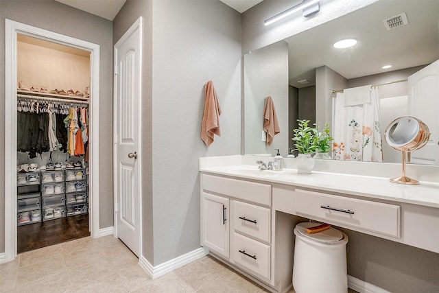 2924 Whitetail Chase Dr, Fort Worth, TX 76108 - bathroom with vanity, tile patterned floors, a spacious closet, baseboards, and a shower with curtain