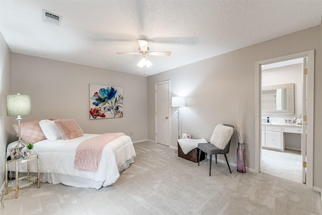 23 Crosslands Rd, Benbrook, TX 76132 - bedroom with light colored carpet, baseboards, a ceiling fan, and ensuite bathroom