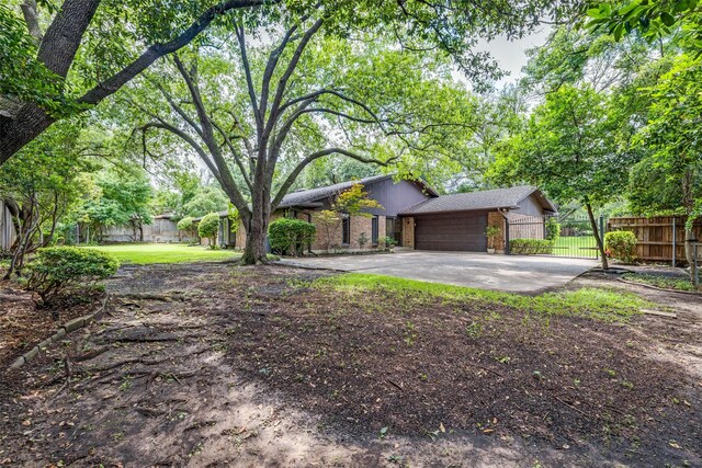 23 Crosslands Rd, Benbrook, TX 76132 - view of front facade featuring brick siding, a garage, and driveway