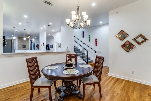 3320 Douglas Ave Unit C, Dallas, TX 75219 - dining area featuring baseboards, a chandelier, light wood-type flooring, and recessed lighting