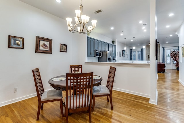 3320 Douglas Ave Unit C, Dallas, TX 75219 - dining area featuring light wood-style floors, a chandelier, baseboards, and recessed lighting