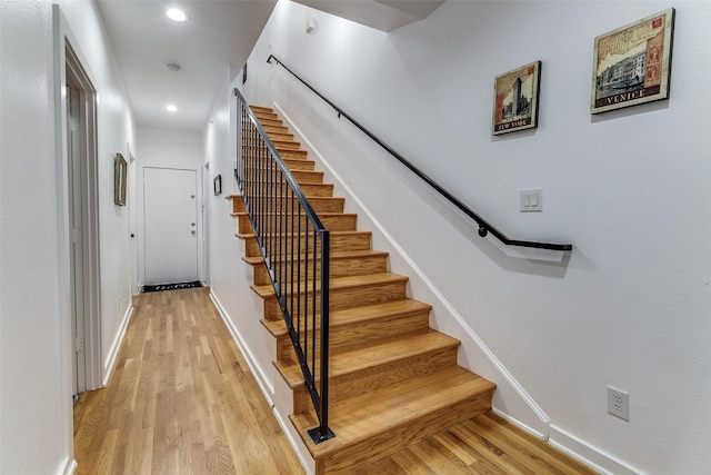 3320 Douglas Ave Unit C, Dallas, TX 75219 - staircase featuring wood finished floors, baseboards, and recessed lighting