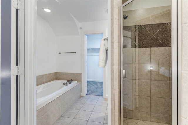 3320 Douglas Ave Unit C, Dallas, TX 75219 - bathroom featuring a stall shower, a garden tub, and tile patterned flooring