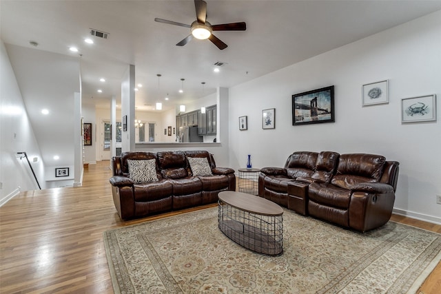 3320 Douglas Ave Unit C, Dallas, TX 75219 - living room featuring ceiling fan, wood finished floors, and baseboards