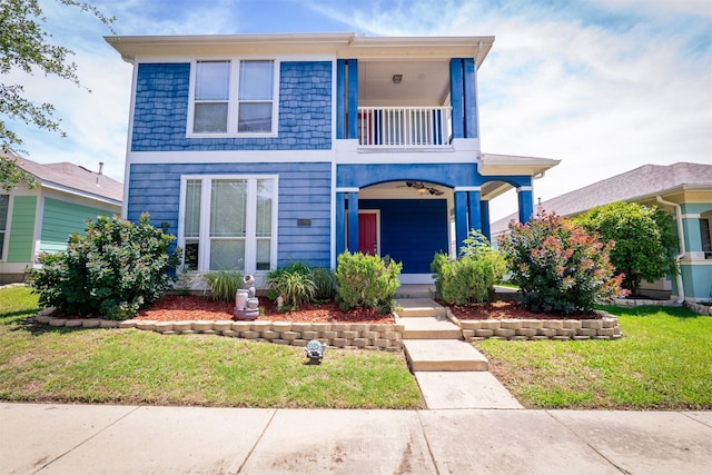 10940 Dillon St, Fort Worth, TX 76179 - view of front facade featuring a balcony and a front lawn