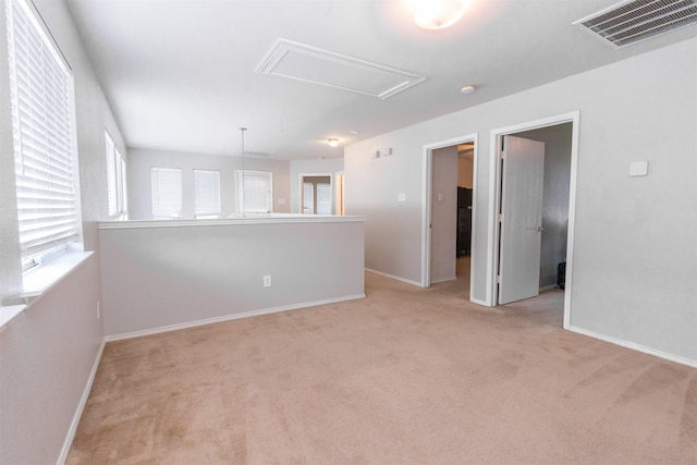 10940 Dillon St, Fort Worth, TX 76179 - carpeted spare room featuring attic access, baseboards, and a smoke detector