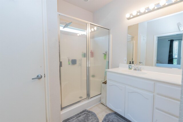 10940 Dillon St, Fort Worth, TX 76179 - bathroom featuring a stall shower, vanity, and tile patterned flooring