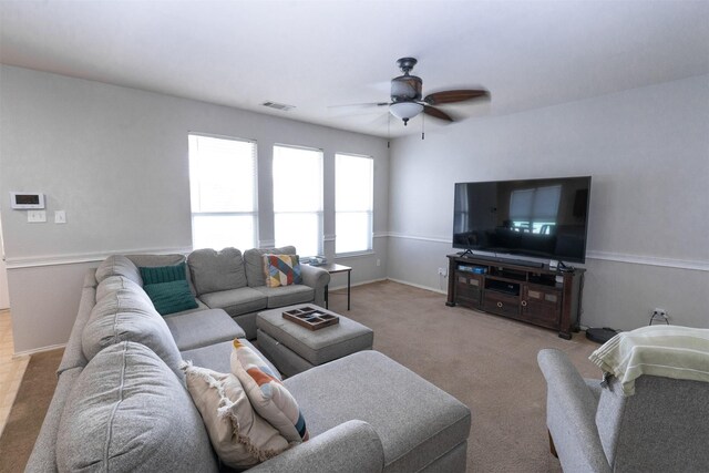 10940 Dillon St, Fort Worth, TX 76179 - carpeted living room featuring a ceiling fan and baseboards