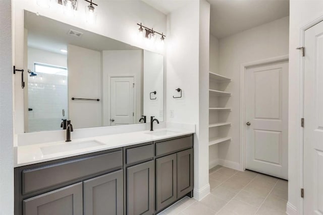 514 Hillcrest Cir, Justin, TX 76247 - full bathroom featuring double vanity, a stall shower, and tile patterned flooring