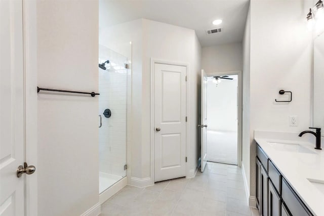514 Hillcrest Cir, Justin, TX 76247 - full bath featuring a stall shower, double vanity, tile patterned flooring, baseboards, and ceiling fan