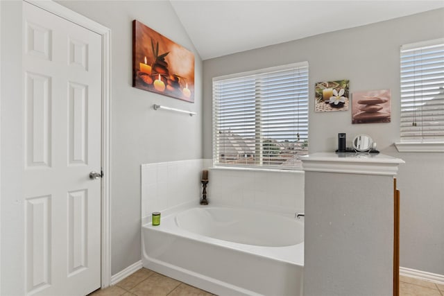 403 Elmcrest Ct, Forney, TX 75126 - full bath with a bath, tile patterned flooring, baseboards, and vaulted ceiling