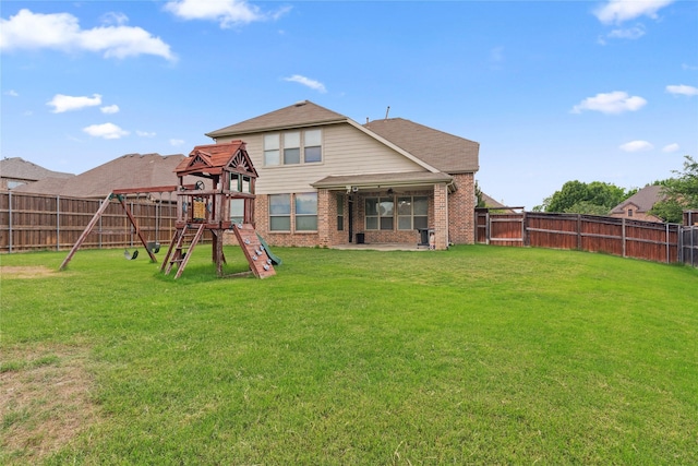 403 Elmcrest Ct, Forney, TX 75126 - back of property featuring a playground and brick siding
