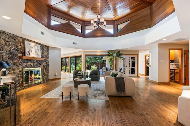 8907 Meadowknoll Dr, Dallas, TX 75243 - living area featuring a towering ceiling, beverage cooler, baseboards, wood ceiling, and wood finished floors