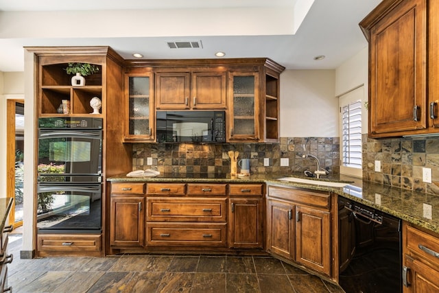 8907 Meadowknoll Dr, Dallas, TX 75243 - kitchen featuring black appliances, open shelves, a sink, dark stone counters, and glass insert cabinets