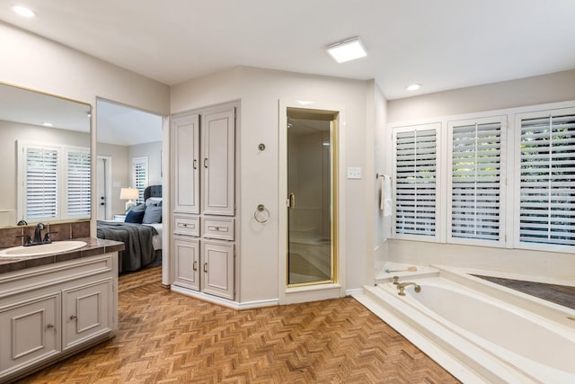8907 Meadowknoll Dr, Dallas, TX 75243 - full bath featuring vanity, a garden tub, connected bathroom, recessed lighting, and a stall shower