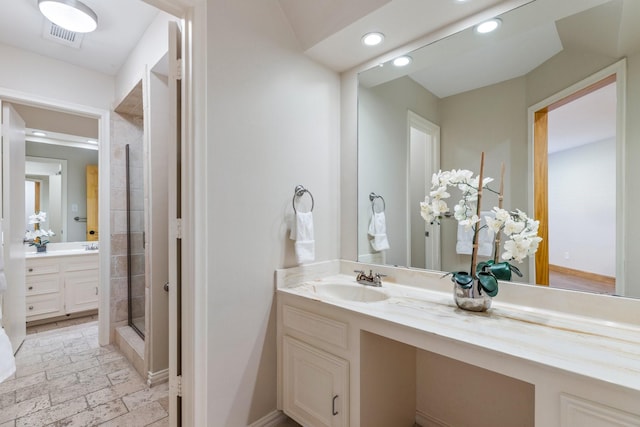 8907 Meadowknoll Dr, Dallas, TX 75243 - bathroom with recessed lighting, a shower stall, vanity, and baseboards