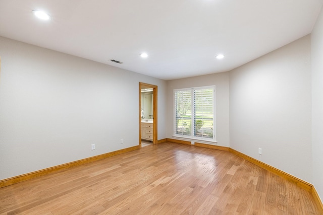 8907 Meadowknoll Dr, Dallas, TX 75243 - empty room with light wood-type flooring, baseboards, and recessed lighting