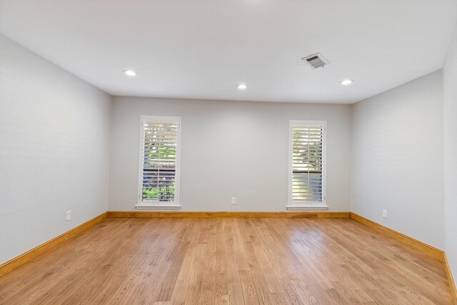 8907 Meadowknoll Dr, Dallas, TX 75243 - empty room with baseboards, light wood-style flooring, and recessed lighting