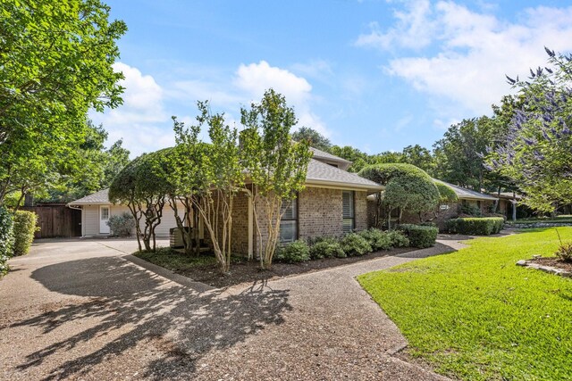 8907 Meadowknoll Dr, Dallas, TX 75243 - view of property hidden behind natural elements with brick siding