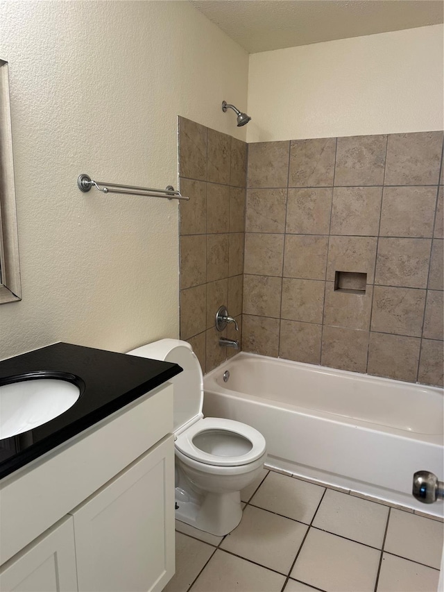 836 Cedar Ridge Ln, Burleson, TX 76028 - bathroom with tile patterned floors, vanity, washtub / shower combination, toilet, and a textured wall