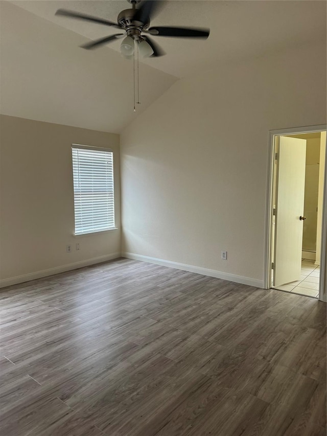 836 Cedar Ridge Ln, Burleson, TX 76028 - spare room with vaulted ceiling, ceiling fan, wood finished floors, and baseboards