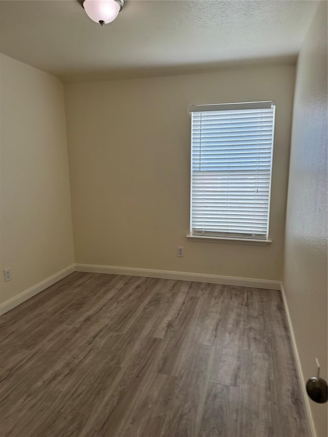 836 Cedar Ridge Ln, Burleson, TX 76028 - spare room with wood finished floors and baseboards