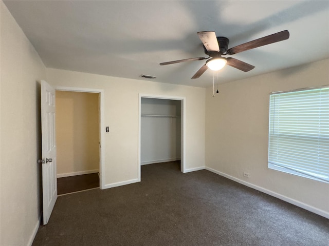 921 Longino St, Sulphur Springs, TX 75482 - unfurnished bedroom featuring dark carpet, baseboards, a closet, and ceiling fan