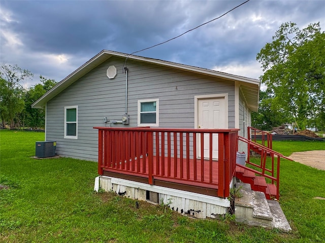 921 Longino St, Sulphur Springs, TX 75482 - back of property with a yard, central AC unit, and a wooden deck