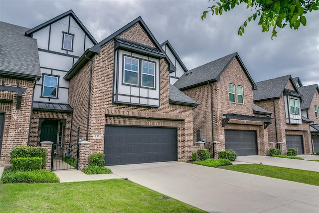 135 Claire Dr, Trophy Club, TX 76262 - tudor home featuring a garage, driveway, brick siding, and roof with shingles
