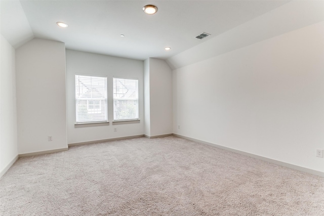 135 Claire Dr, Trophy Club, TX 76262 - empty room featuring vaulted ceiling, light carpet, recessed lighting, and baseboards
