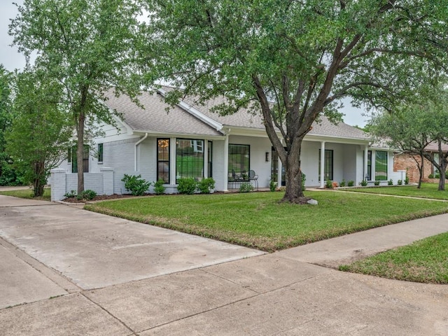 3414 Country Club Rd, Pantego, TX 76013 - view of front of house with a front lawn, roof with shingles, a porch, and brick siding
