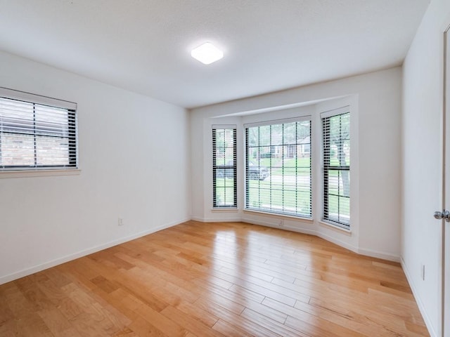 3414 Country Club Rd, Pantego, TX 76013 - unfurnished room featuring light wood-style flooring and baseboards