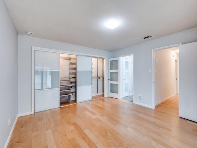 3414 Country Club Rd, Pantego, TX 76013 - unfurnished bedroom featuring light wood-type flooring, baseboards, and a closet