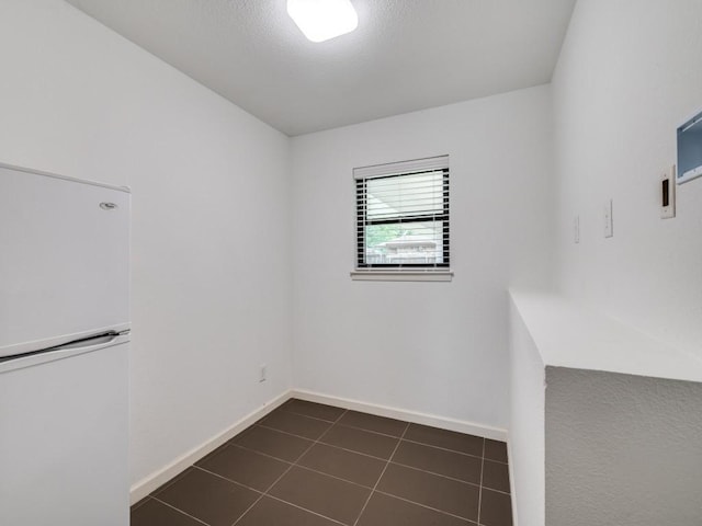 3414 Country Club Rd, Pantego, TX 76013 - unfurnished room featuring baseboards and dark tile patterned floors