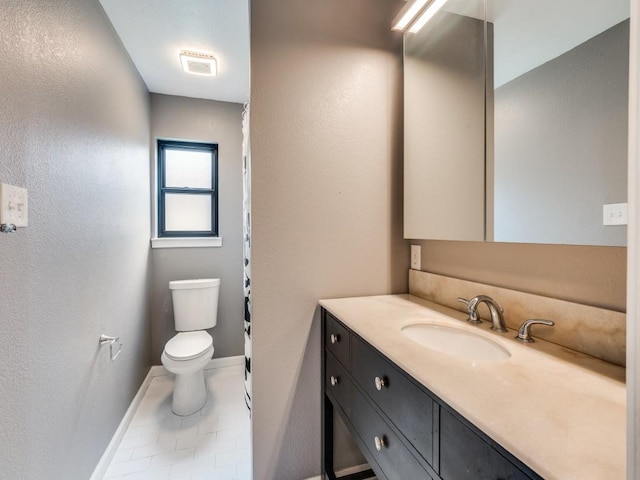 3414 Country Club Rd, Pantego, TX 76013 - bathroom featuring vanity, toilet, baseboards, and tile patterned floors