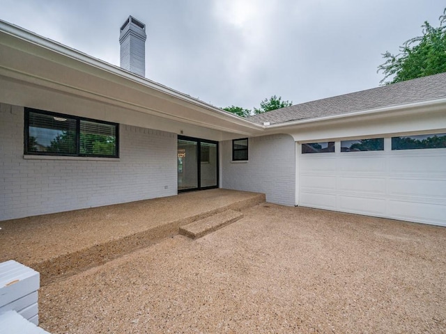 3414 Country Club Rd, Pantego, TX 76013 - exterior space with brick siding, a garage, a chimney, and concrete driveway