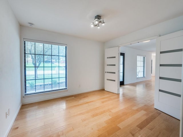 3414 Country Club Rd, Pantego, TX 76013 - empty room with baseboards and light wood-style floors
