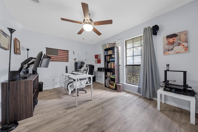 22 Buttercup Cir, Waco, TX 76708 - home office featuring a ceiling fan, light wood finished floors, and baseboards