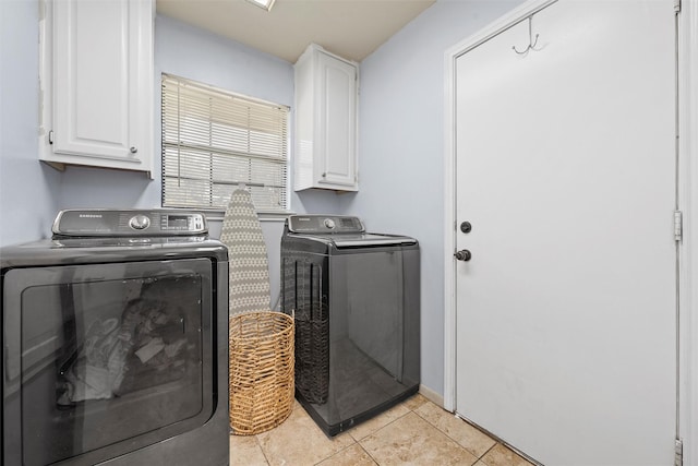 22 Buttercup Cir, Waco, TX 76708 - washroom featuring washer and dryer, cabinet space, and light tile patterned floors