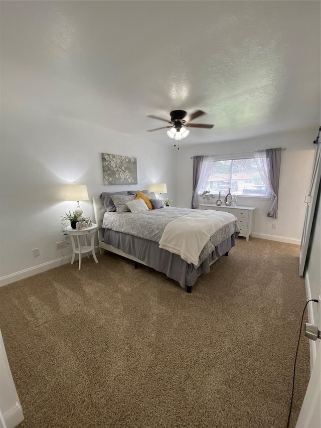 4313 Windsor Dr, Garland, TX 75042 - carpeted bedroom featuring baseboards and ceiling fan