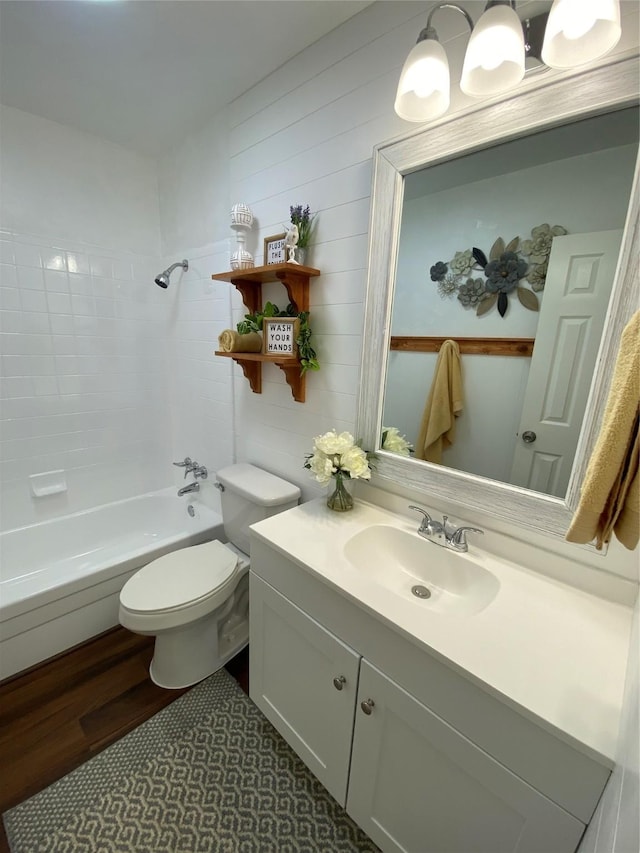 4313 Windsor Dr, Garland, TX 75042 - full bathroom featuring toilet, vanity, shower / bathtub combination, and wood finished floors