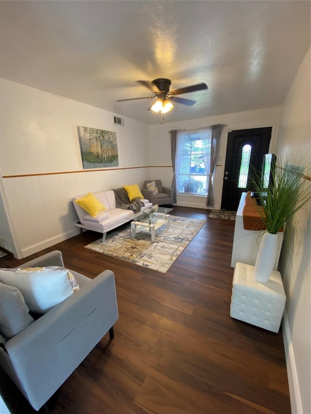 4313 Windsor Dr, Garland, TX 75042 - living room featuring ceiling fan, wood finished floors, and a wainscoted wall