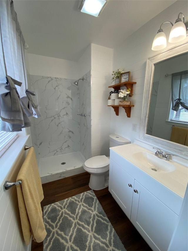 4313 Windsor Dr, Garland, TX 75042 - bathroom with vanity, a marble finish shower, wood finished floors, and toilet