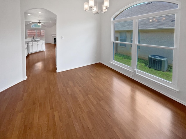 4162 Stone Hollow Way, Fort Worth, TX 76040 - unfurnished room with dark wood finished floors, a ceiling fan, baseboards, and a fireplace