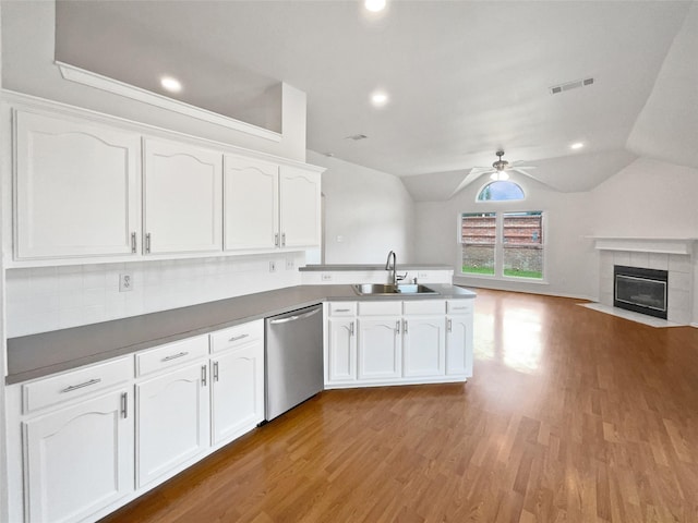 4162 Stone Hollow Way, Fort Worth, TX 76040 - kitchen featuring stainless steel dishwasher, a sink, a peninsula, white cabinets, and open floor plan