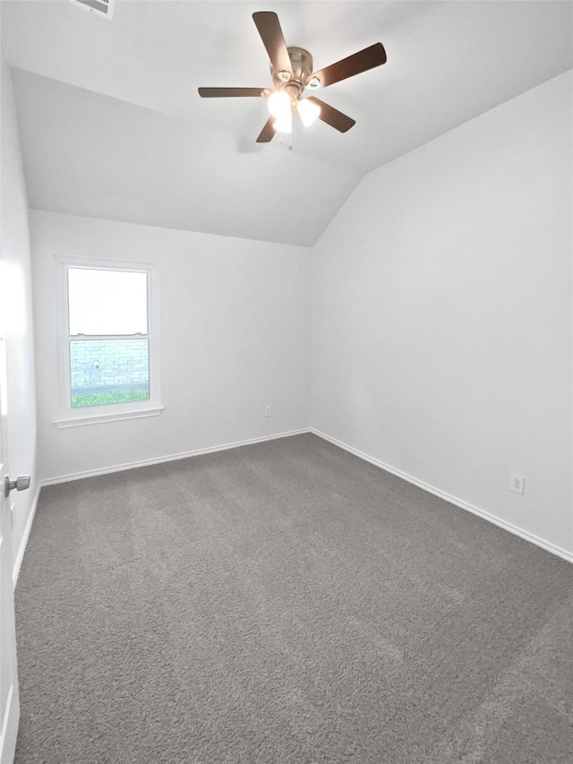 4162 Stone Hollow Way, Fort Worth, TX 76040 - spare room with lofted ceiling, a ceiling fan, baseboards, and dark carpet