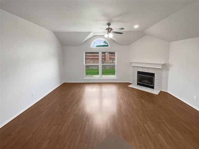 4162 Stone Hollow Way, Fort Worth, TX 76040 - unfurnished living room with a tiled fireplace, wood finished floors, ceiling fan, baseboards, and vaulted ceiling