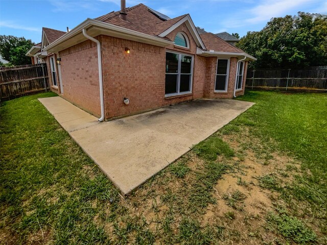 4162 Stone Hollow Way, Fort Worth, TX 76040 - back of property featuring a patio area, brick siding, and roof with shingles